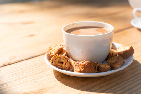 A closeup shot of tea time with snacks in white cutlery set in Manali, Himachal Pradeshの写真素材