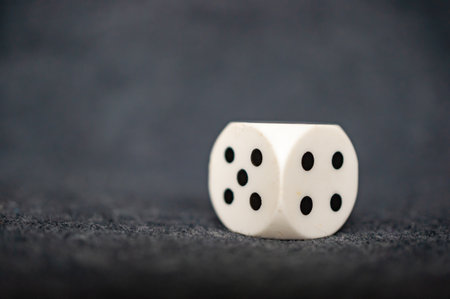 A closeup of dice roll with five and four on both sides