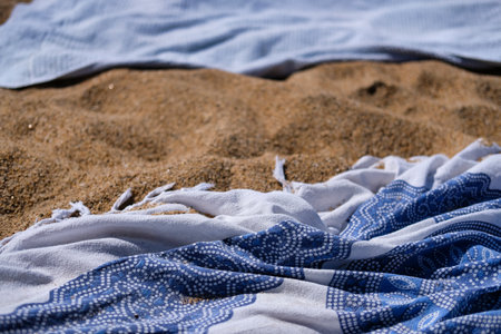 A closeup shot of a decorative scarf on sandの写真素材