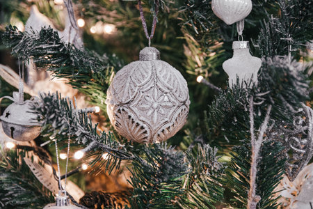 A closeup of beautiful silver ornaments on a festive Christmas treeの写真素材