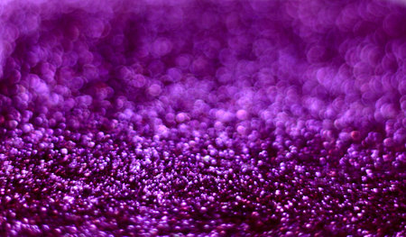 Shiny violet sequins, blurred abstract background
