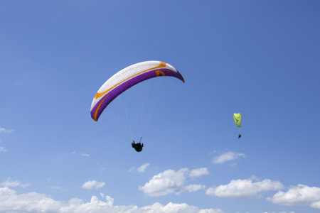 A beautiful shot of paragliding flight over Bellegarde Sur Valserine, departing from Sorgia, Ain,...
