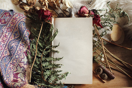 A top view of copy space decorated with spruce branches and roses