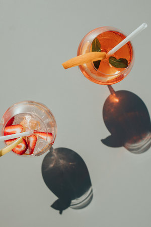 A vertical shot of cocktails with lemonsの写真素材