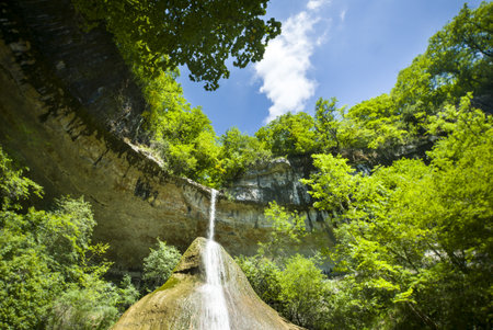 A mesmerizing shot of Pain de Sucre waterfall in Ain, Franceの写真素材