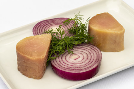 A closeup of a traditional Turkish appetizer Lakerda, with tuna, red onions and herbsの写真素材