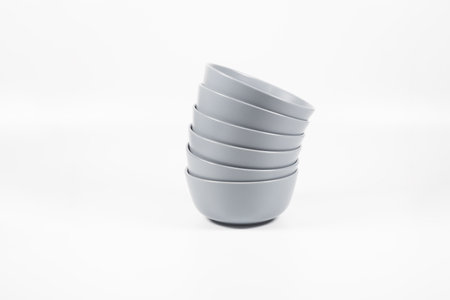 A closeup shot of bowls on white backgroundの写真素材