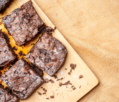 A top view of chocolate cake pieces on a wooden surfaceの写真素材