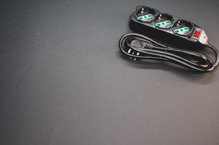 A black surge protector on a black backgroundの写真素材