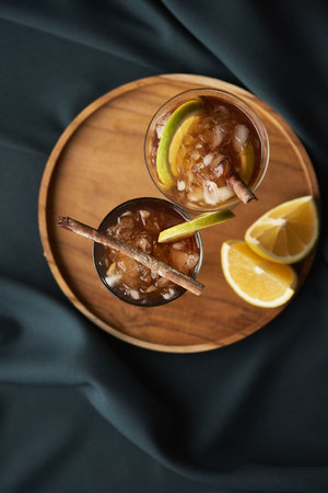 Refreshing Cubalibre, served with pieces of Orange to decorate