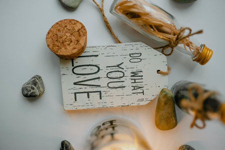 A closeup shot of a wooden piece with the do what you love in a decoration setの写真素材