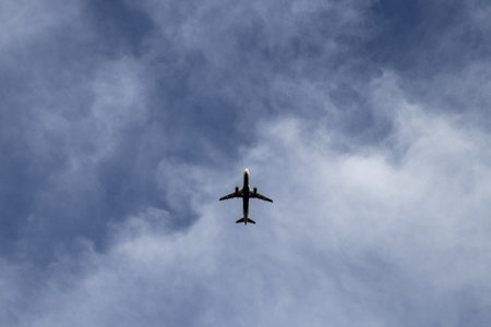A low angle shot of an airplane during flight