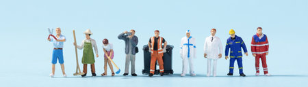 A closeup of toy people with different jobs on a blue background