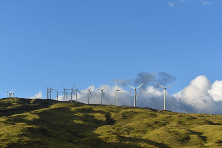 A closeup of mountain wind generators turbines on a mountainside of, Maui, Hawaii
