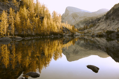 The Perfection lake in the Enchantment Lakes surrounded by rocks and trees in autumn