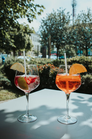 A vertical shot of cocktails with lemonsの写真素材