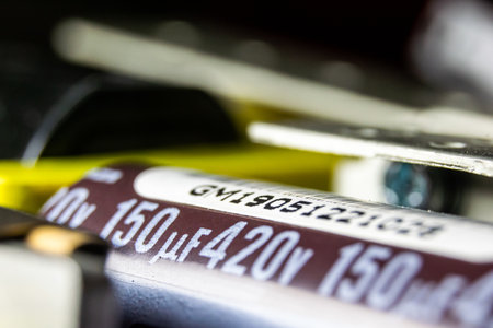 A selective focus of the PC capacitor under the lights with a blurry background
