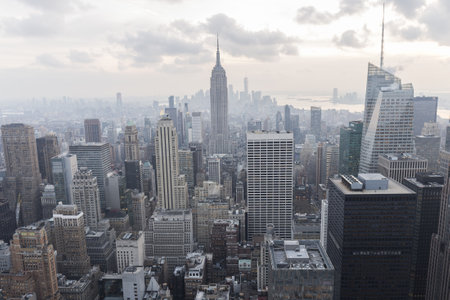 Manhattan skyscrapers seen from the Top of the rock viewpoint in the rockefeller building, hundreds of buildings seen from above, the sky has cloudsのeditorial素材
