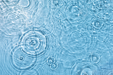 A high angle shot of water ripples on the surface of the water