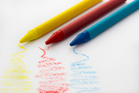 The primary colors painted by wax colors on a white sheetの写真素材