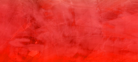 A background of a red cement wall with a cop