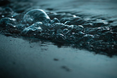 A closeup of the beach and sea waves with a blurry background - perfect for wallpapers