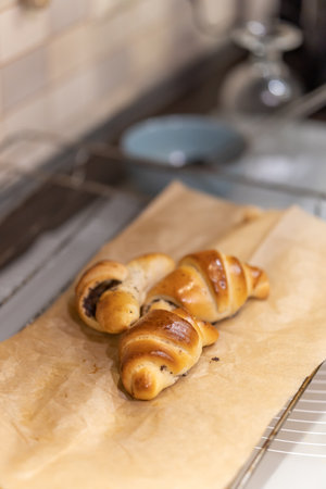 A selective focus shot of delicious croissantswith poppy seeds