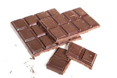 A closeup of delicious chocolate bars isolated on a white background