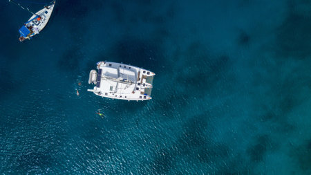 A big yacht with boats in the sea in summer in Greece
