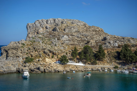 The sailing boats in the lagoon surrounded by rocky cliffsの写真素材