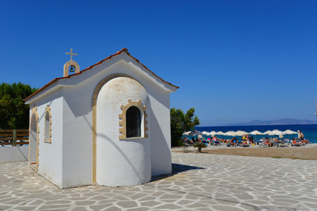 The facade of a small church near the beach by the beautiful oceanの写真素材
