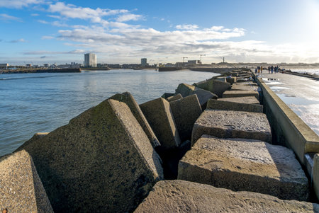 Large concrete blocks in perspective to protect the harbor of Scheveningen from storm wavesの写真素材