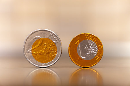 A selective focus shot of euro coins with space for text