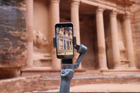 A closeup shot of a phone documenting an ancient architectural building