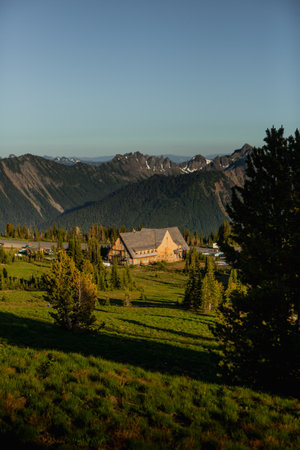 A vertical shot of a building in a mountainous region on a sunny day