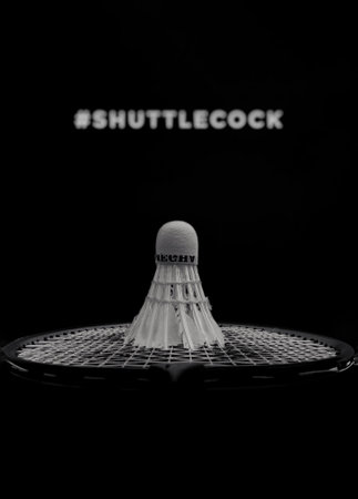 Black and White photograph of Shuttlecock on a badminton racquet