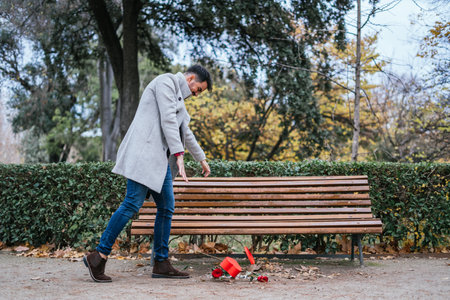 A shallow focus shot of a young male throwing the present box on the groundの写真素材