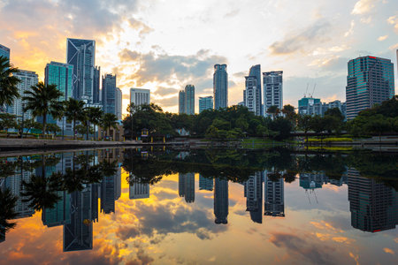A beautiful view of cityscape reflecting in lake at sunset