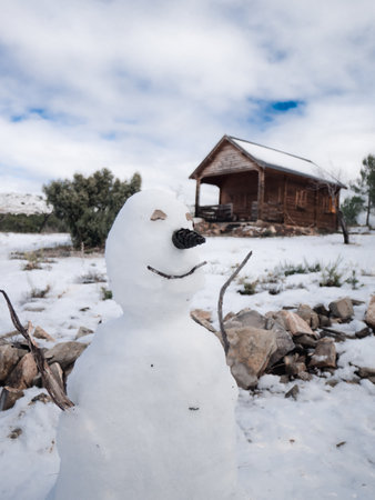 A beautiful shot of a smiling snowman in Filomena Storm in the village of Alcublas, at Valencia,...
