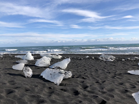The frozen snow on the beach captured on a cloudy day during the daytimeの写真素材