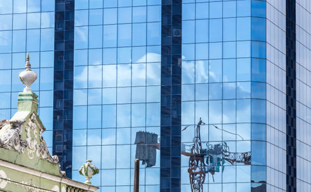 A beautiful view of a modern building with crane reflectionの写真素材