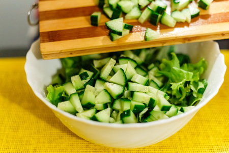 A cucumber and lettuce salad - preparation procesの写真素材