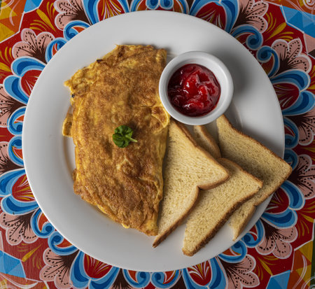 An overhead shot of a delicious breakfast dish on a patterned surfaceの写真素材