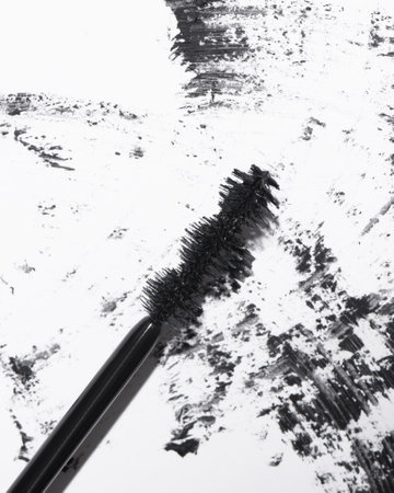 A closeup shot of black mascara on white backgroundの写真素材
