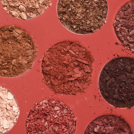 A closeup shot of broken multicolor eyeshadow as samples of cosmetic beauty productの写真素材