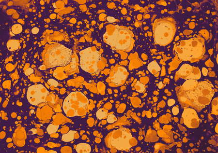 The beautiful mixture of purple paint and gold paint on a canvas