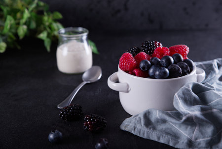 Healthy diet with red fruits such as blackberries, blueberries, raspberries and yogurt.の写真素材