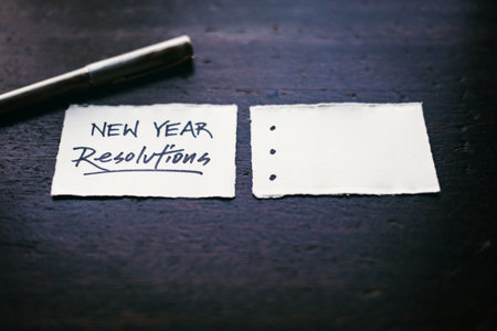 A closeup shot of a piece of paper with new year resolutions written on itの写真素材