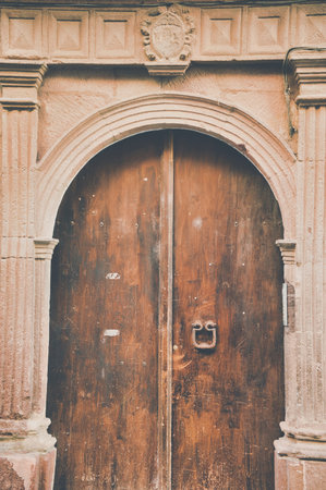 A vertical shot of old wooden doorの写真素材