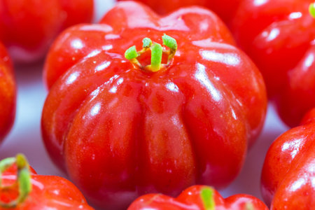 A closeup shot of bright red Brazilian cherriesの写真素材